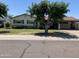 Charming single-story home with well-maintained lawn and mature tree offering shade at 6637 E Culver St, Scottsdale, AZ 85257
