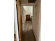 Hallway leading to bedroom with natural light, wooden closet doors, and carpet floor at 6637 E Culver St, Scottsdale, AZ 85257