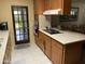 Well-lit kitchen with a black cooktop and appliances at 6637 E Culver St, Scottsdale, AZ 85257