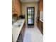 Galley kitchen featuring stainless steel appliances and wooden cabinetry at 6637 E Culver St, Scottsdale, AZ 85257