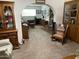 Spacious living room showcasing hardwood furniture and brick fireplace, perfect for gathering and creating memories at 6637 E Culver St, Scottsdale, AZ 85257