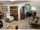 Cozy living room with carpet flooring, furnishings, and arched doorway at 6637 E Culver St, Scottsdale, AZ 85257