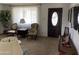 Cozy living room featuring comfortable seating, neutral carpet, and a large window providing natural light at 6637 E Culver St, Scottsdale, AZ 85257
