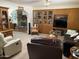 Inviting living room with brick fireplace, built-in shelving, and comfortable seating for relaxing and entertaining at 6637 E Culver St, Scottsdale, AZ 85257