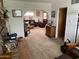 Open-concept living room with comfortable seating, brick fireplace, and natural light, creating a welcoming atmosphere at 6637 E Culver St, Scottsdale, AZ 85257