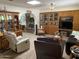 Inviting living room with brick fireplace, built-in shelving, and comfortable seating for relaxing and entertaining at 6637 E Culver St, Scottsdale, AZ 85257