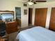 View of primary bedroom featuring blue quilt bedspread, dresser and closet at 6637 E Culver St, Scottsdale, AZ 85257