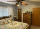 Bedroom features floral bedspread, wood dresser, and soft wall color for a cozy retreat at 6637 E Culver St, Scottsdale, AZ 85257