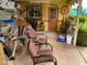 Covered patio with eclectic decor, seating, and a 'Casa de Locos' sign adding personality at 6637 E Culver St, Scottsdale, AZ 85257