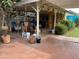 Spacious patio with a covered area, nautical decor, and a mix of brick and stone flooring at 6637 E Culver St, Scottsdale, AZ 85257