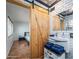 This bathroom features a decorative mirror, toilet, and a barn door at 6901 E Oak St, Scottsdale, AZ 85257
