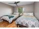 This bedroom features two beds and a ceiling fan at 6901 E Oak St, Scottsdale, AZ 85257