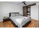 This bedroom features a sliding barn door and hardwood floors at 6901 E Oak St, Scottsdale, AZ 85257