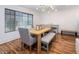 Inviting dining room with modern light fixture, hardwood floors, and a bright, airy ambiance at 6901 E Oak St, Scottsdale, AZ 85257