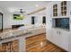 Open-concept living area with bright kitchen, hardwood floors, and contemporary design elements at 6901 E Oak St, Scottsdale, AZ 85257