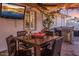 This covered patio has string lights and a dining table at 6901 E Oak St, Scottsdale, AZ 85257