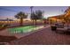Sparkling swimming pool with patio area, seating, and lush landscaping, perfect for outdoor living at 6901 E Oak St, Scottsdale, AZ 85257