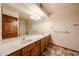 Bathroom with vanity, large mirror, tile floor, and shower/tub combo at 6940 W Willow Ave, Peoria, AZ 85381