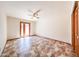 Bedroom with tile floors, ceiling fan, walk out doors to yard, and closet space at 6940 W Willow Ave, Peoria, AZ 85381