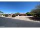 Charming single-story home with a tile roof, desert landscaping, and a spacious driveway and front yard at 6940 W Willow Ave, Peoria, AZ 85381