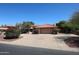 Charming single-story home with a tile roof, desert landscaping, and a spacious driveway and front yard at 6940 W Willow Ave, Peoria, AZ 85381