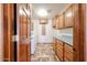 Bright laundry room with washer, dryer, cabinets, and plenty of storage space at 6940 W Willow Ave, Peoria, AZ 85381