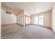 Living room features large arched windows and glass doors for lots of natural light at 6940 W Willow Ave, Peoria, AZ 85381