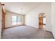 Spacious living room features a chandelier and large window for ample natural light at 6940 W Willow Ave, Peoria, AZ 85381