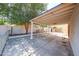 Large covered patio with concrete flooring and white columns offering a perfect outdoor living and entertaining space at 6940 W Willow Ave, Peoria, AZ 85381