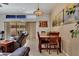 Comfortable dining area with a wooden table, chairs, and natural light from sliding glass doors at 7006 E Jensen St # 48, Mesa, AZ 85207