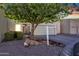 Charming single-story home with desert landscaping, mature trees, and an inviting entrance at 7006 E Jensen St # 48, Mesa, AZ 85207