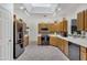 Bright kitchen with stainless steel appliances, wood cabinets, and a tiled backsplash at 7006 E Jensen St # 48, Mesa, AZ 85207