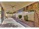 Enclosed patio area with concrete flooring, ceiling fans, and lattice details, offering an outdoor relaxation space at 7006 E Jensen St # 48, Mesa, AZ 85207