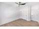 Empty bedroom featuring a ceiling fan, neutral paint and flooring, and closet space at 802 N Lisbon Dr, Chandler, AZ 85226