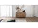 Bedroom featuring stylish decor, light hardwood floors, and white walls at 802 N Lisbon Dr, Chandler, AZ 85226