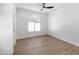 Empty bedroom featuring neutral walls and an arched window at 802 N Lisbon Dr, Chandler, AZ 85226