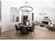 Stylish dining room features modern chandelier, seating for six, and adjacent living spaces at 802 N Lisbon Dr, Chandler, AZ 85226
