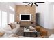 Elegant living room with paneled accent wall, sleek TV console, and bright natural light at 802 N Lisbon Dr, Chandler, AZ 85226