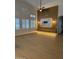 Bright living room with contemporary wall paneling, a modern fireplace, and large windows at 802 N Lisbon Dr, Chandler, AZ 85226