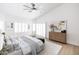 This bright main bedroom offers plantation shutters and stylish decor at 802 N Lisbon Dr, Chandler, AZ 85226