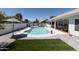 Resort-style backyard featuring a sparkling pool, and an outdoor kitchen at 802 N Lisbon Dr, Chandler, AZ 85226