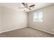 Bedroom with neutral colored walls, carpeted floors and a large window with blinds allowing natural light at 823 E Agua Fria Ln, Avondale, AZ 85323