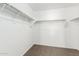 Walk-in closet with carpeted floor, shelving, and rack for hanging clothes at 823 E Agua Fria Ln, Avondale, AZ 85323