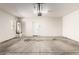 Spacious two car garage with water heater, and an entrance door at 823 E Agua Fria Ln, Avondale, AZ 85323