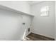 Laundry room featuring a window, overhead shelf, hookups, and vinyl flooring at 823 E Agua Fria Ln, Avondale, AZ 85323
