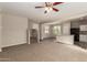 Open-concept living room and kitchen area with staircase, offering a modern and airy atmosphere at 823 E Agua Fria Ln, Avondale, AZ 85323