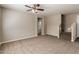 Inviting living room featuring neutral walls, plush carpet, and staircase leading to the upper level at 823 E Agua Fria Ln, Avondale, AZ 85323