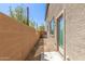 Side yard features gravel and a concrete block wall at 823 E Agua Fria Ln, Avondale, AZ 85323