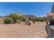 Spacious backyard featuring a charming pergola seating area, surrounded by low-maintenance landscaping, ideal for relaxation at 872 E Saratoga St, Gilbert, AZ 85296
