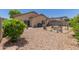 Spacious backyard with a covered patio, lush greenery, and an inviting pergola seating area, perfect for outdoor gatherings at 872 E Saratoga St, Gilbert, AZ 85296